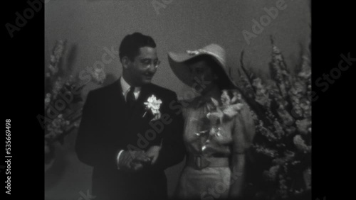 Newlyweds Pose 1938 - A newlywed couple poses for pictues after their wedding in Los Angeles, California in 1938.