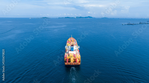 Photography Stern of large cargo ship import export container box on the ocean sea on blue s