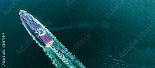 Cargo container Ship, cargo maritime ship with contrail in the ocean ship carrying container and running for export concept technology freight shipping sea freight by Express Ship