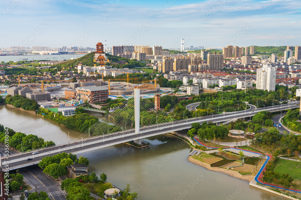 Overlooking the skyline and canal bridge of modern urban architecture in Jiangyin, China