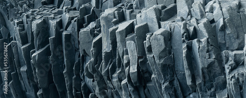 Gray rock banner. Abstract stone background. Textured basalt stone wall. Close-up. Light gray rock backdrop.