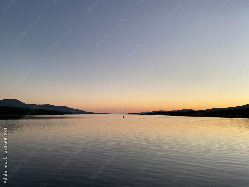 Kenmare bay at sunset viewed from Kenmare pier, Kerry, Ireland.