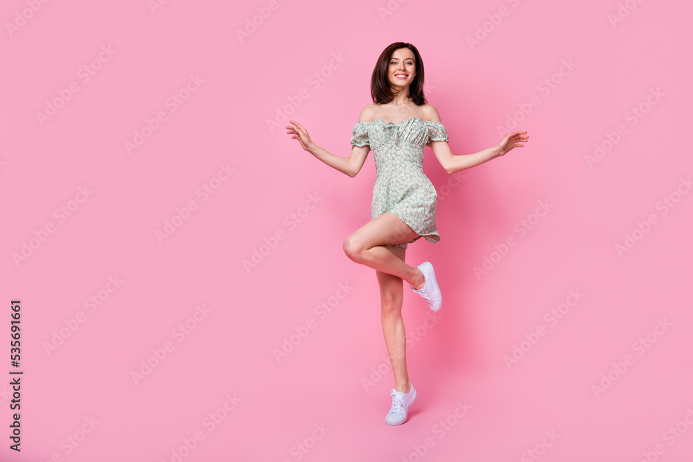 Full length photo of funky pretty girl dressed off shoulders outfit dancing empty space isolated pink color background