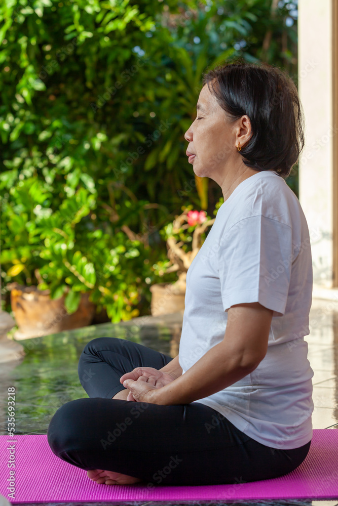 old asian woman exercising, doing yoga old asian woman exercising, doing yoga