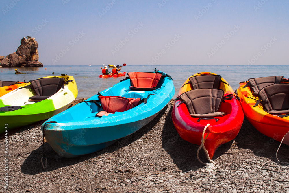 Kayak, boats with oars on the seashore for water travel. Crimea, Black Sea Kayak, boats with oars on the seashore for water travel. Crimea, Black Sea