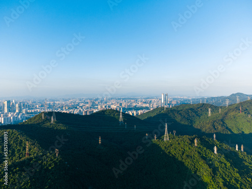 Shenzhen Meilin Mountain Country Park and high voltage transmission tower on the mountain photo