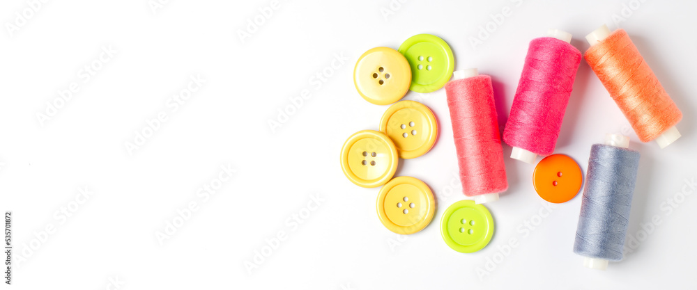 Accessories for sewing on a white background. Closeup. Copy space Accessories for sewing on a white background. Closeup. Copy space