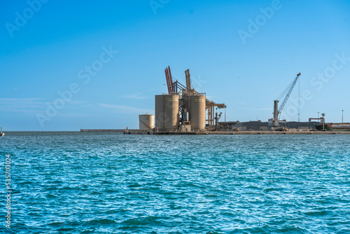 Landscape of the port of Malaga with ciment silo and docks. © ksfilmr