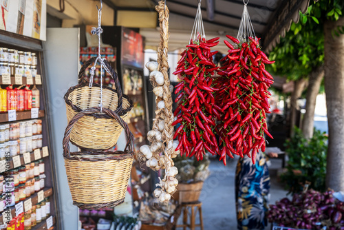 Calabrian red pepper in Tropea street market. Traditional unique ingredient in Calabria's cuisine, symbol of region. Travel vacation in Calabria, southern Italy. photo