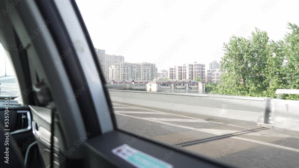 elevated road and modern cityscape out of window of high speed car elevated road and modern cityscape out of window of high speed car