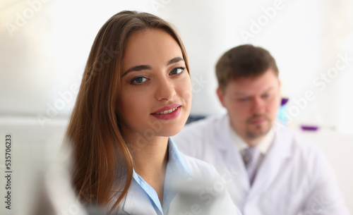 Woman patient at doctor appointment with man