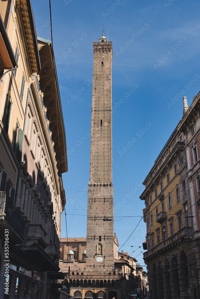 Street in Bologna with Asinelli tower in the center, Emilia Romagna, Italy