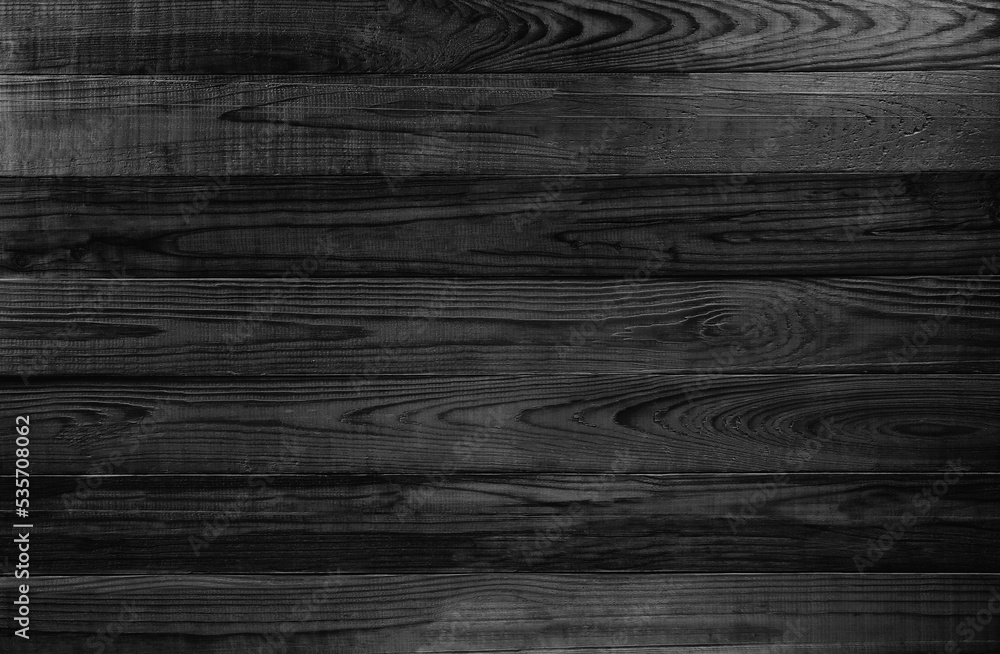 Dark wooden wall of black and white color of interior decoration background.