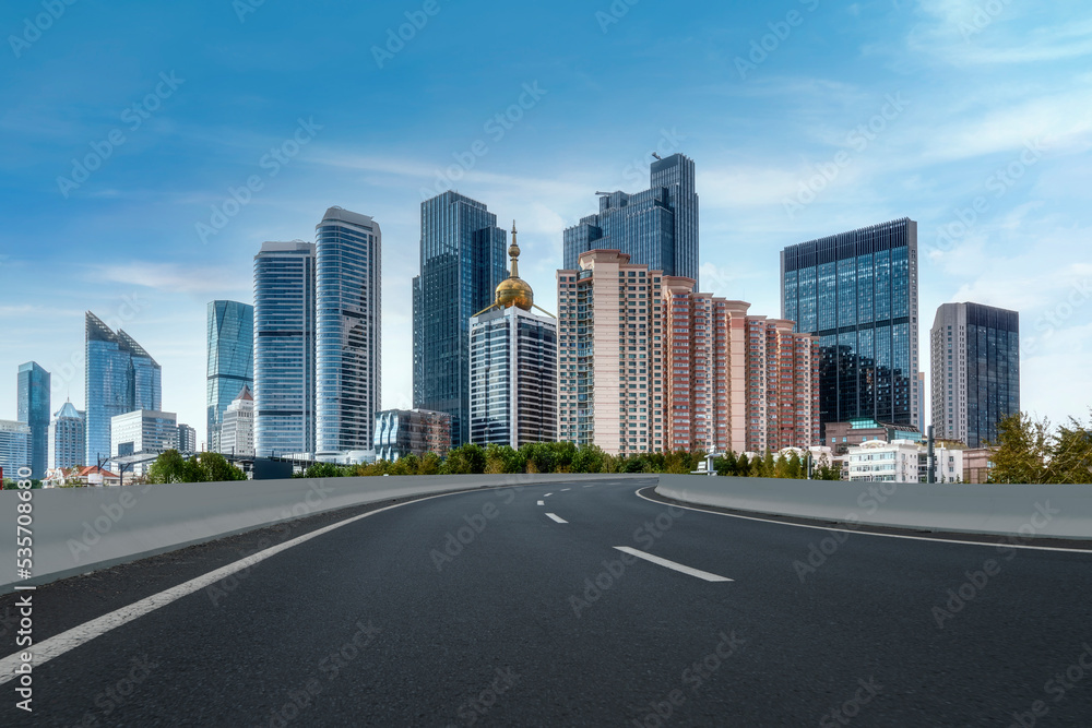 Road and modern city buildings landscape skyline Road and modern city buildings landscape skyline