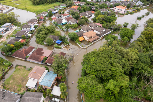 High-angle view of the Great Flood, Meng District, Thailand, on October 3, 2022, is a photograph from real flooding. With a slight color adjustment 