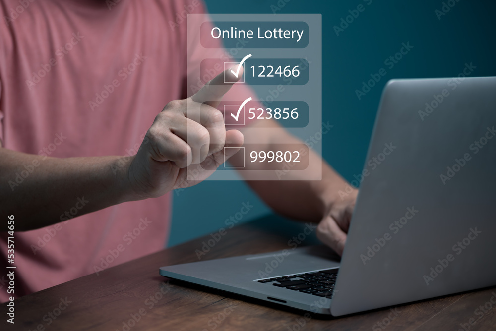 Man using computer and touching on virtual Online lottery screen to buy two number set. Man using computer and touching on virtual Online lottery screen to buy two number set.