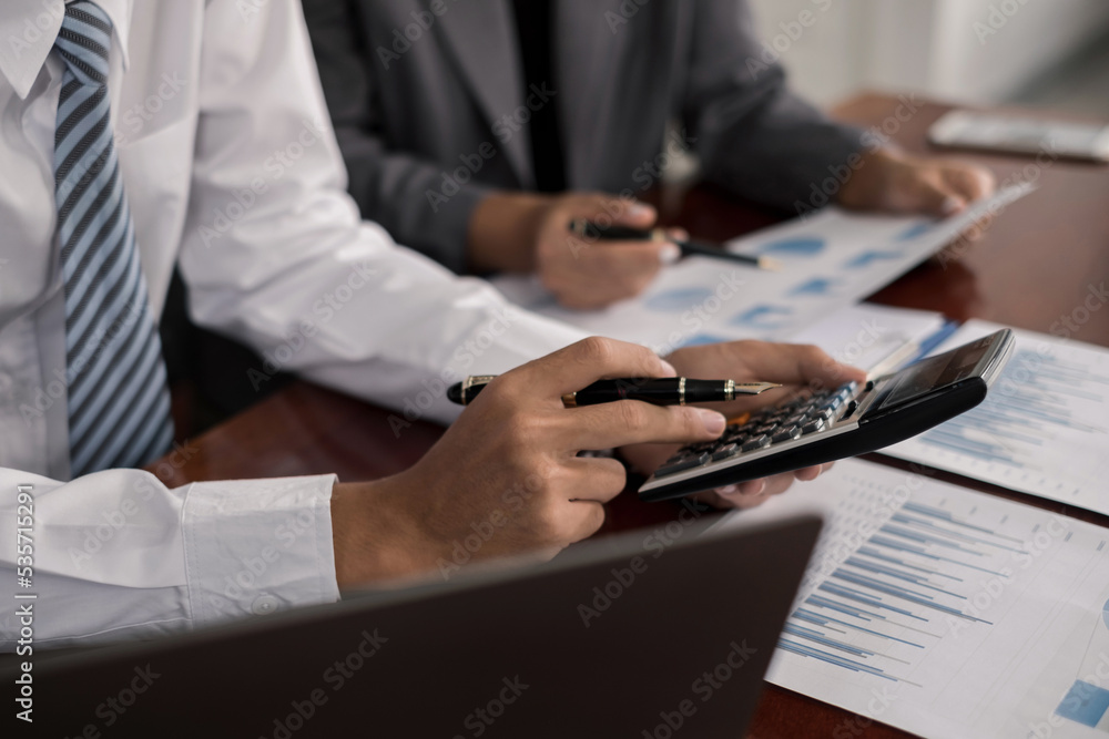 Fototapeta premium Two business leaders talk about charts, financial graphs showing results are analyzing and calculating planning strategies, business success building processes