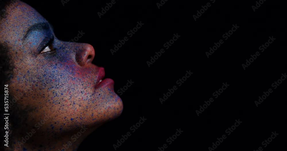 Black woman silhouette, paint makeup and creative, dark fantasy and cosmetics. Shadow face with splash, explosion and creativity of rainbow colors from holi festival, carnival and body art deco Black woman silhouette, paint makeup and creative, dark fantasy and cosmetics. Shadow face with splash, explosion and creativity of rainbow colors from holi festival, carnival and body art deco