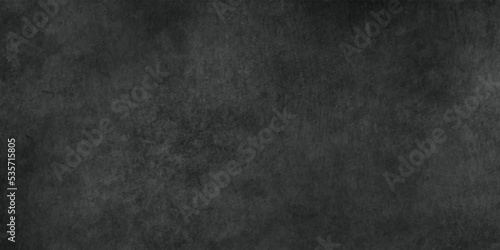 Dark concrete textured wall background.black cement wall texture for interior design. dark edges.copy space for add text.