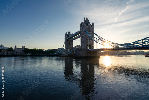 Tower Bridge with sunrise flare in London. England