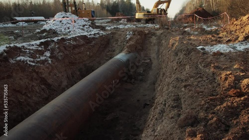 Construction of the main gas pipeline underground. Large long pipe for pumping gas, industry.