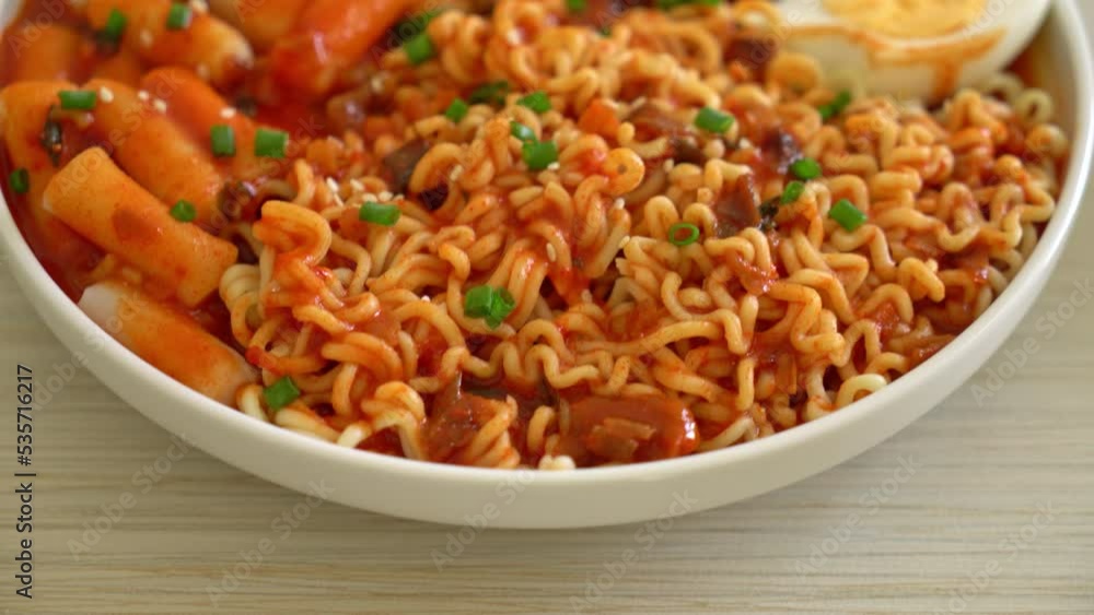 Korean instant noodles with Korean rice cake and fish cake and boiled egg - Rabokki - Korean food style Korean instant noodles with Korean rice cake and fish cake and boiled egg - Rabokki - Korean food style