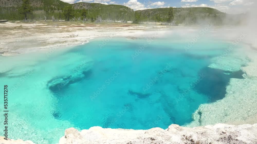 Gorgeous vibrant green and blue hot spring at Yellowstone National Park. Gorgeous vibrant green and blue hot spring at Yellowstone National Park.