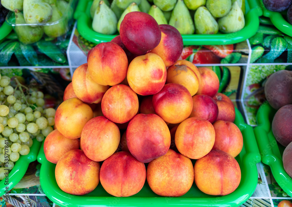 Peaches on the counter in the market. Peaches on the counter in the market.