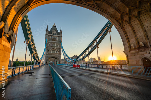 Tower Bridge with sunrise flare in London. England