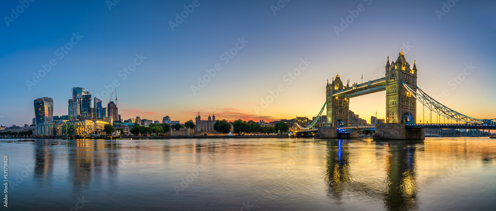 Tower Bridge and finance district panorama at dawn in London
