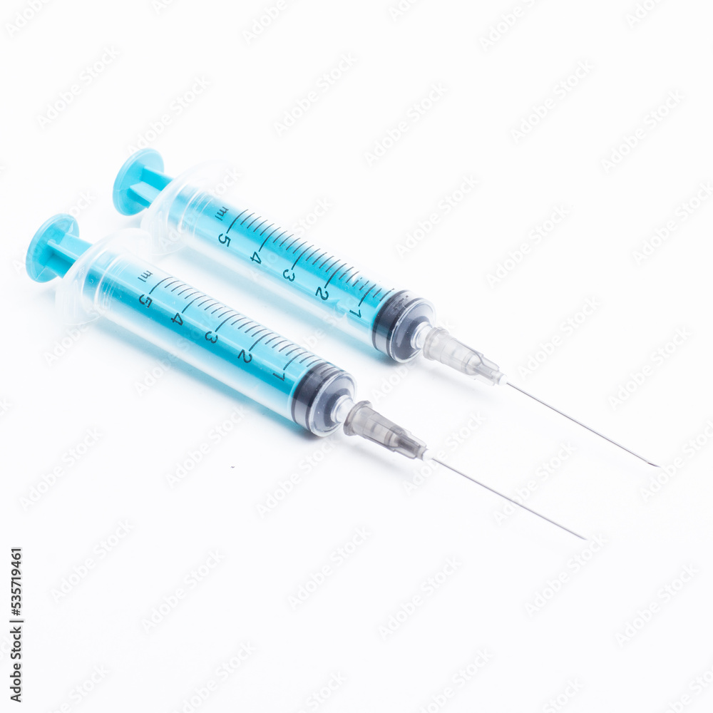 Medical syringe on a white background. A syringe for injection. The concept of health and beauty Medical syringe on a white background. A syringe for injection. The concept of health and beauty