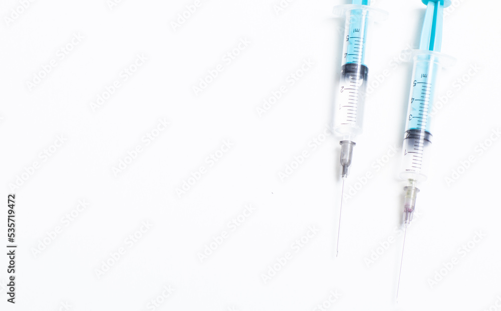 Medical syringe on a white background. A syringe for injection. The concept of health and beauty Medical syringe on a white background. A syringe for injection. The concept of health and beauty