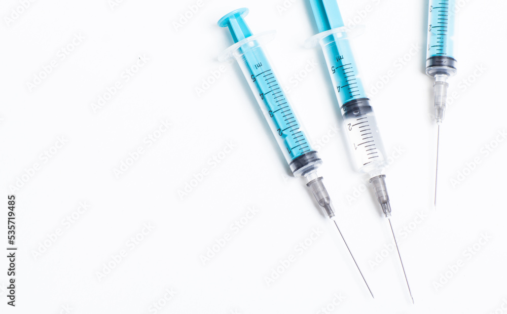 Medical syringe on a white background. A syringe for injection. The concept of health and beauty Medical syringe on a white background. A syringe for injection. The concept of health and beauty