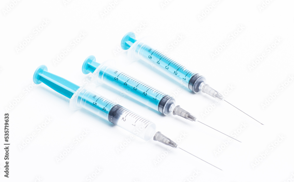 Medical syringe on a white background. A syringe for injection. The concept of health and beauty Medical syringe on a white background. A syringe for injection. The concept of health and beauty