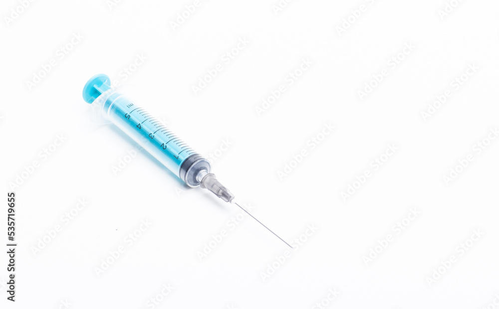 Medical syringe on a white background. A syringe for injection. The concept of health and beauty Medical syringe on a white background. A syringe for injection. The concept of health and beauty
