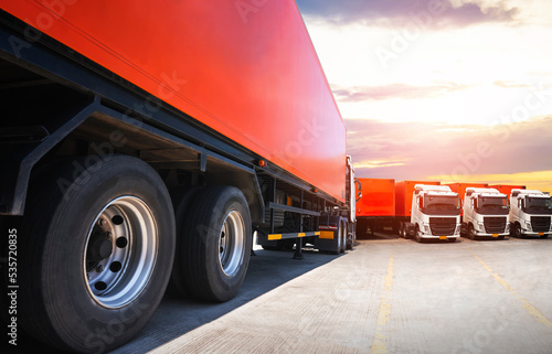 Semi TrailerTrucks on Parking with The Sunset Sky. Shipping Container. Trucking. Truck Wheels Tire. Delivery Transit. Diesel Trucks. Lorry Tractor. Industry Freight Trucks Logistics Cargo Transport. 