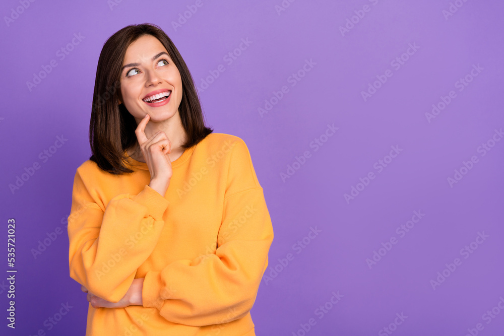 Close up photo of cheerful lovely lady dressed stylish pullover hand touch face look empty space isolated on purple color background Close up photo of cheerful lovely lady dressed stylish pullover hand touch face look empty space isolated on purple color background