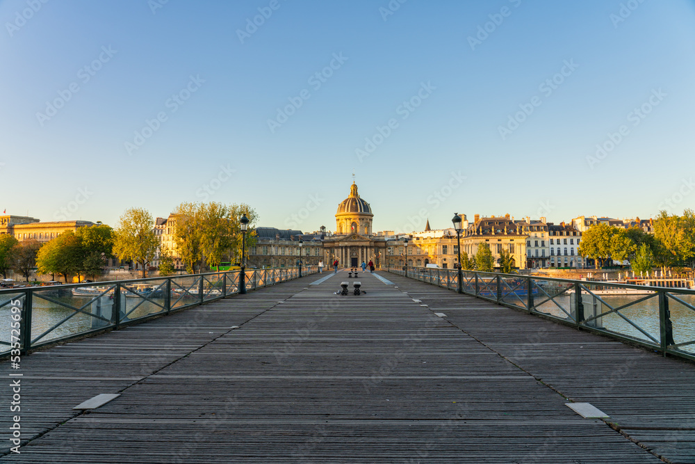 Pont des Arts bridge over the Seine river sunrise overlooking Office Des Longitudes. France
