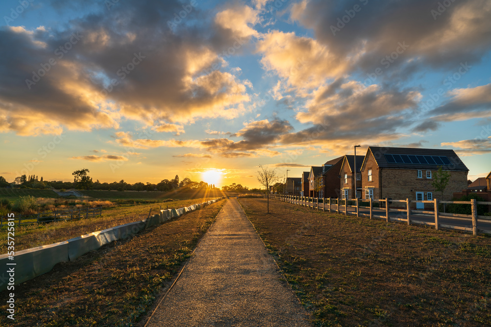 Empty walkway path at sunset near new build housing area in southern England