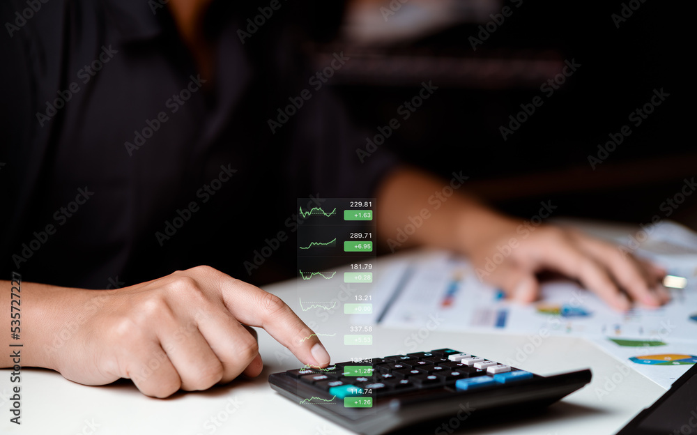 Businessman using calculator with planning business, idea for marketing to project success. Business people analysis data figures to plan business strategies. Business plan growth concept. Businessman using calculator with planning business, idea for marketing to project success. Business people analysis data figures to plan business strategies. Business plan growth concept.