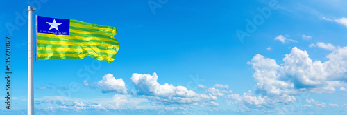 Piauí - state of Brazil, flag waving on a blue sky in beautiful clouds - Horizontal banner photo
