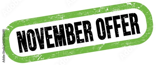 NOVEMBER OFFER, text written on green-black stamp sign.