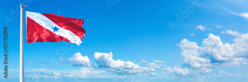 Pará - state of Brazil, flag waving on a blue sky in beautiful clouds - Horizontal banner