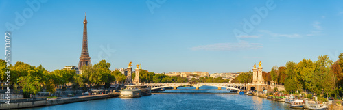 Fotografie Morning sunlight panorama of Pont Alexandre III bridge with Eiffel Tower in the background in Paris