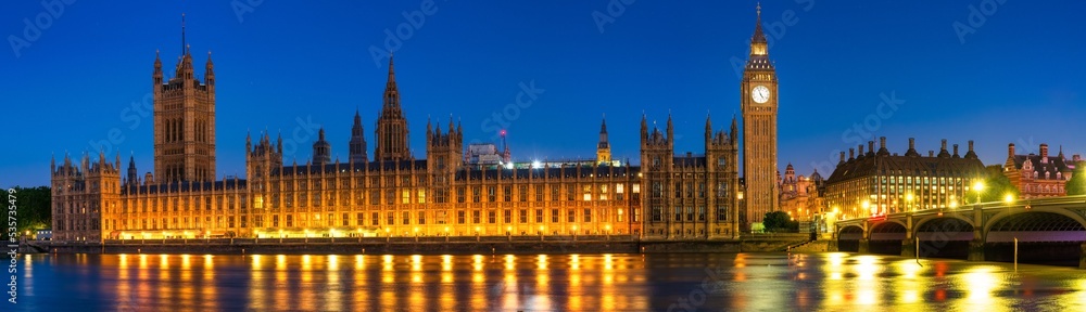 Night time panorama of Big Ben and Westminster in London. England