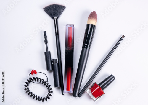 decorative cosmetics, nail polish, makeup brushes, eyelash or eyebrow brushes, mascara on white background, care cosmetics concept, beauty salon or beauty and fashion industry