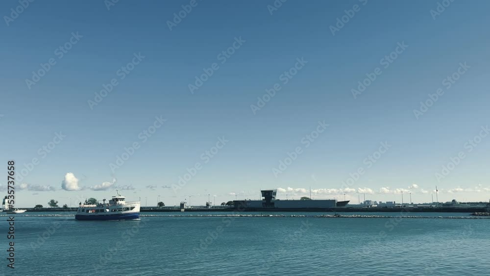 A fast motor boat on Lake Michigan enters the port of the city of Chicago in the USA. A fast motor boat on Lake Michigan enters the port of the city of Chicago in the USA.