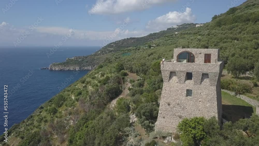 Man enjoys panoramic view from tourism tower: Torre di Fossa Papa Man enjoys panoramic view from tourism tower: Torre di Fossa Papa