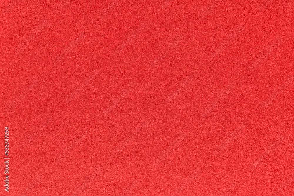Texture of bright red and ruby colors paper background, macro. Structure of dense craft garnet cardboard. Texture of bright red and ruby colors paper background, macro. Structure of dense craft garnet cardboard.