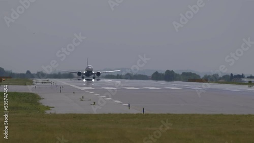 Passenger plane taking off from Milan airport.